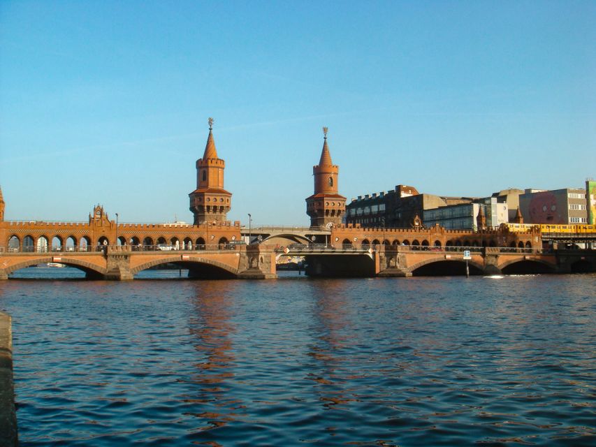 Berlin: 2.5-Hour East Side Boat Cruise with Commentary - East Side Gallery and the Oberbaum Bridge view from the river