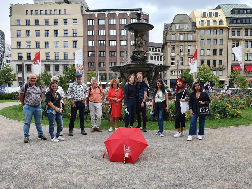 Explore Düsseldorf with Passionate tour guides! - Meeting at Leonidas: red umbrella logistics that actually work