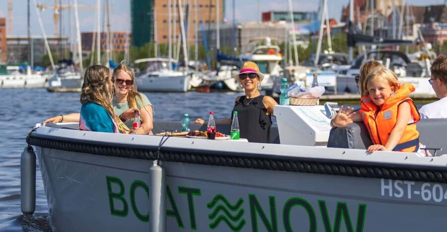 Rostock: Electric Boat Rental on the Warnow River - What you will see from the water: cranes, shipping, and the skyline